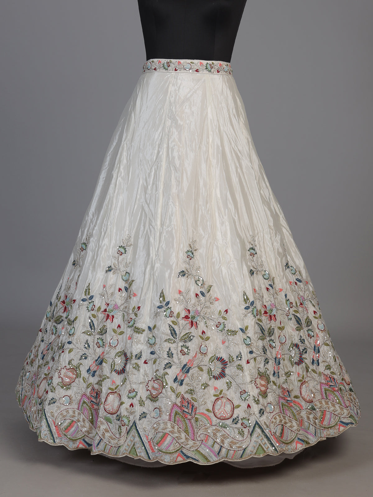 White tissue silk lehenga choli featuring exquisite zardosi embellishments