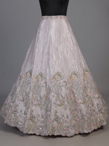 Pink tissue silk lehenga choli adorned with floral bird artistry
