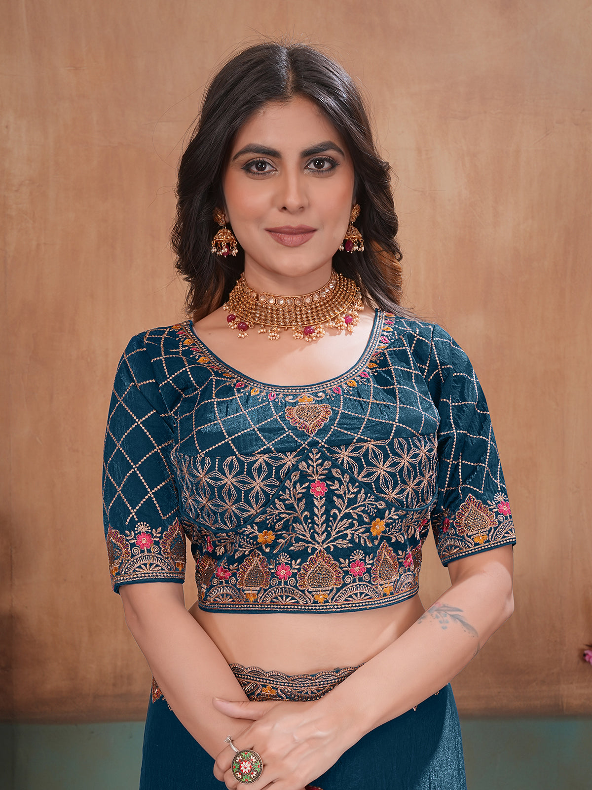 Peacock blue graceful embroidered satin festive saree