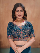 Peacock blue graceful embroidered satin festive saree