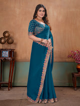 Peacock blue graceful embroidered satin festive saree