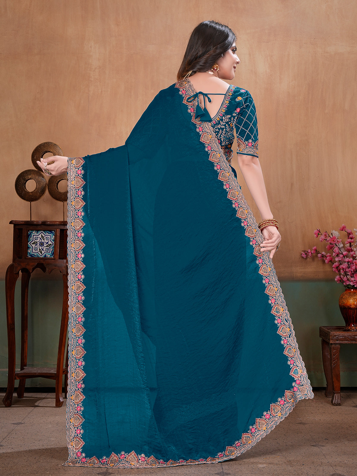 Peacock blue graceful embroidered satin festive saree