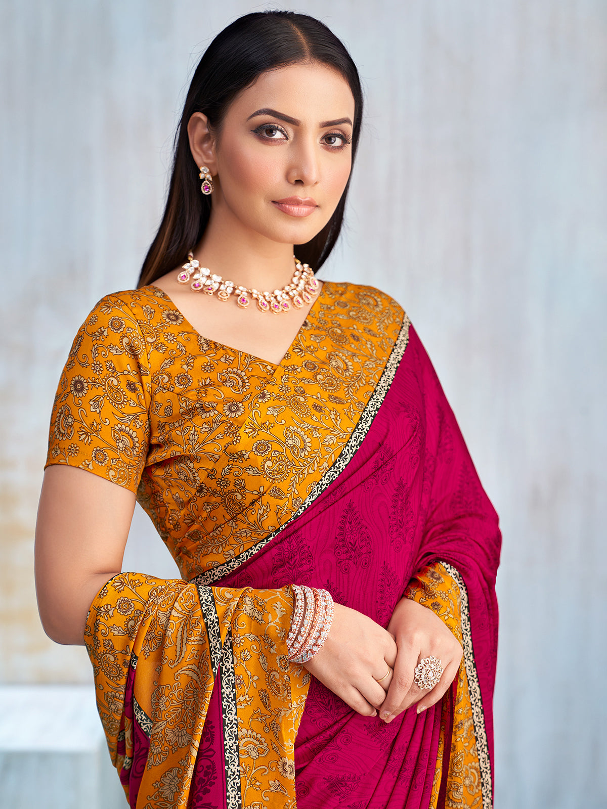 Rani pink floral printed contrast border and pallu saree