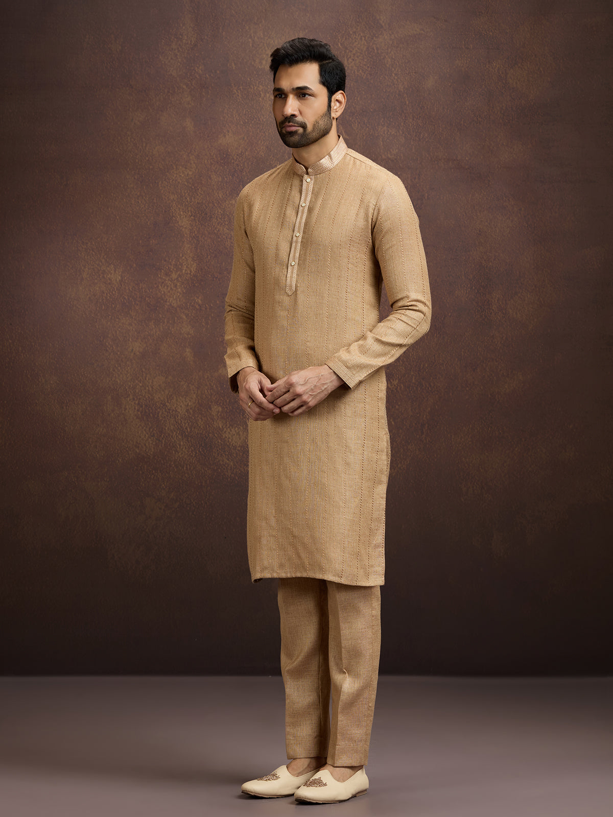Gold graceful embroidered linen kurta pajama attire