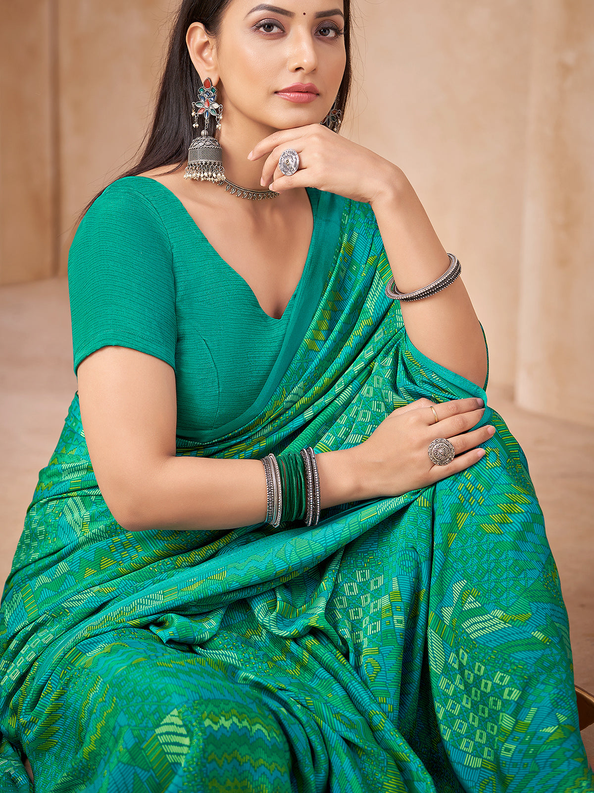 Green abstract printed crepe silk saree