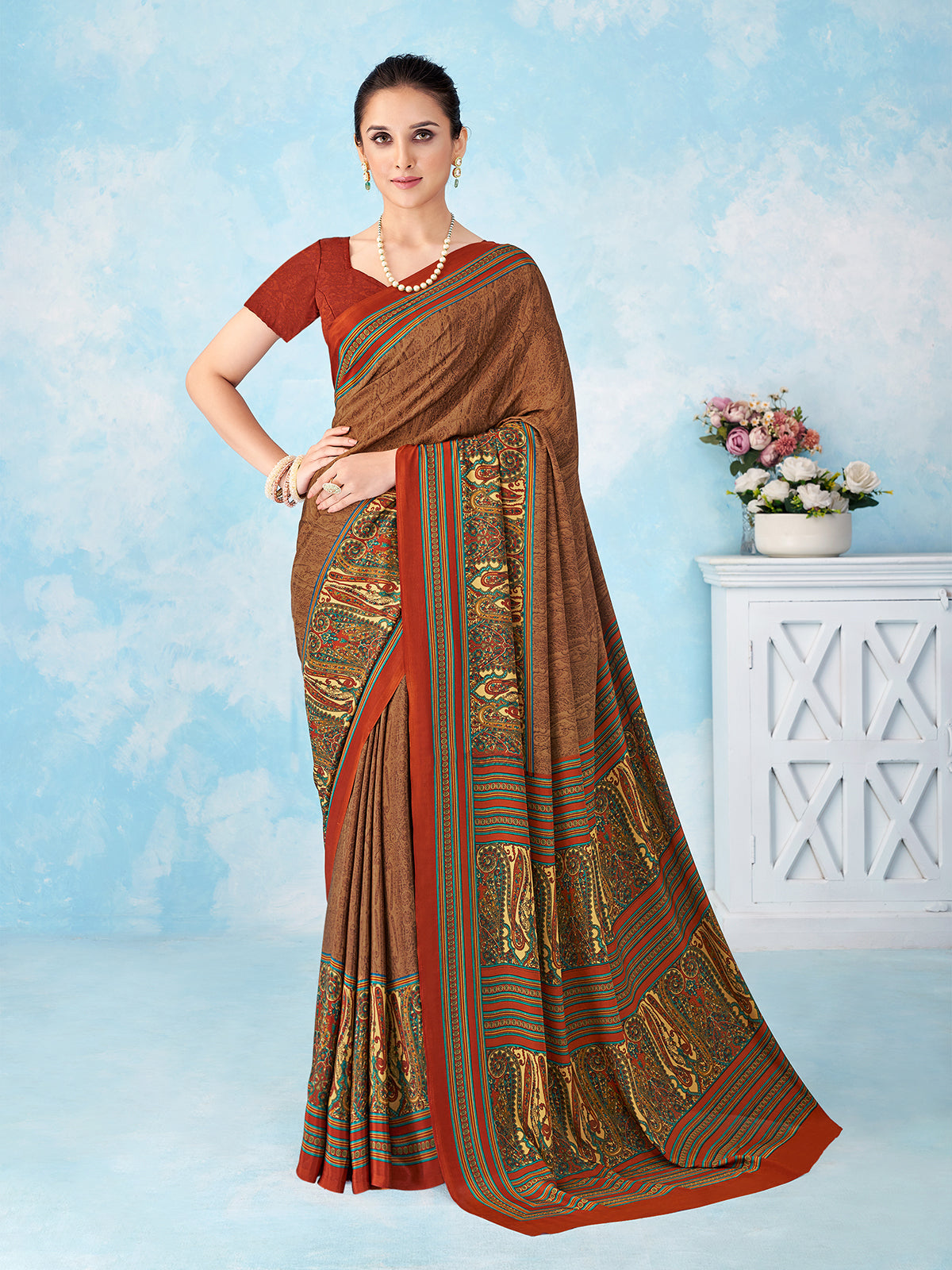 Rust brown printed crepe silk saree with unstitched blouse