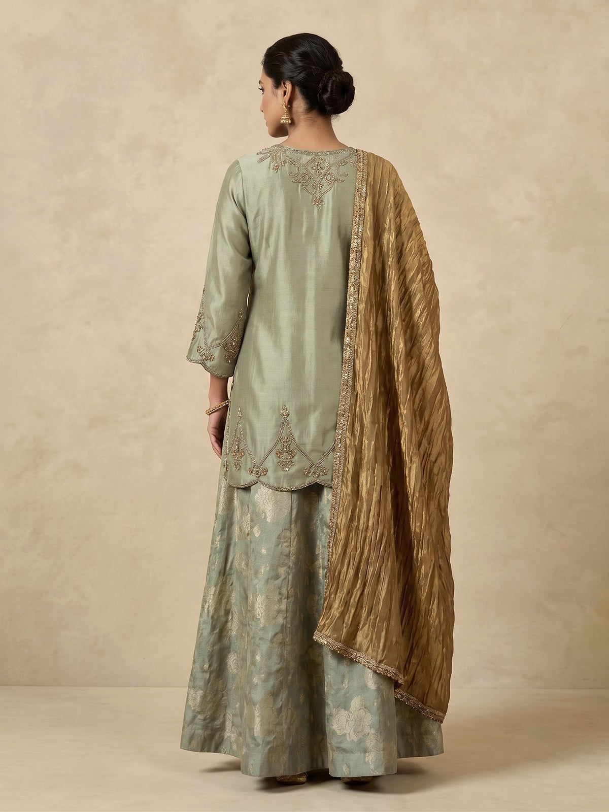 Pastel green women gold floral sharara suit