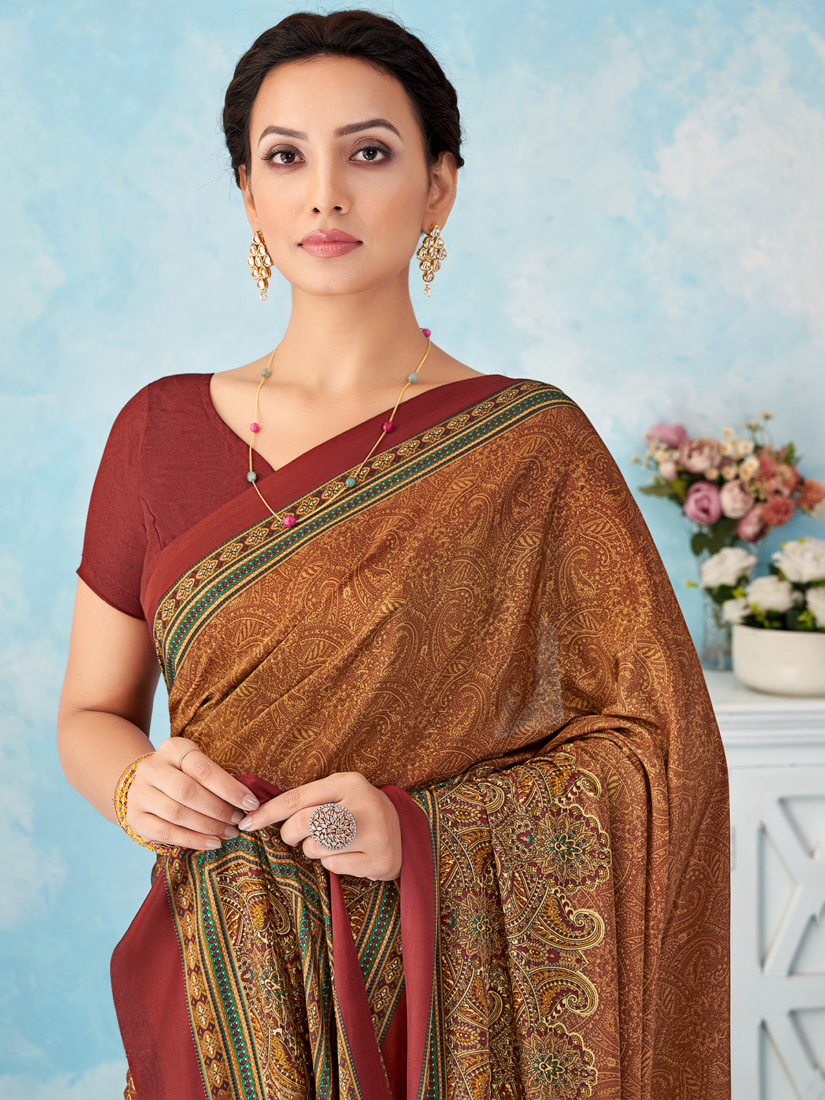 Rust orange printed crepe silk saree