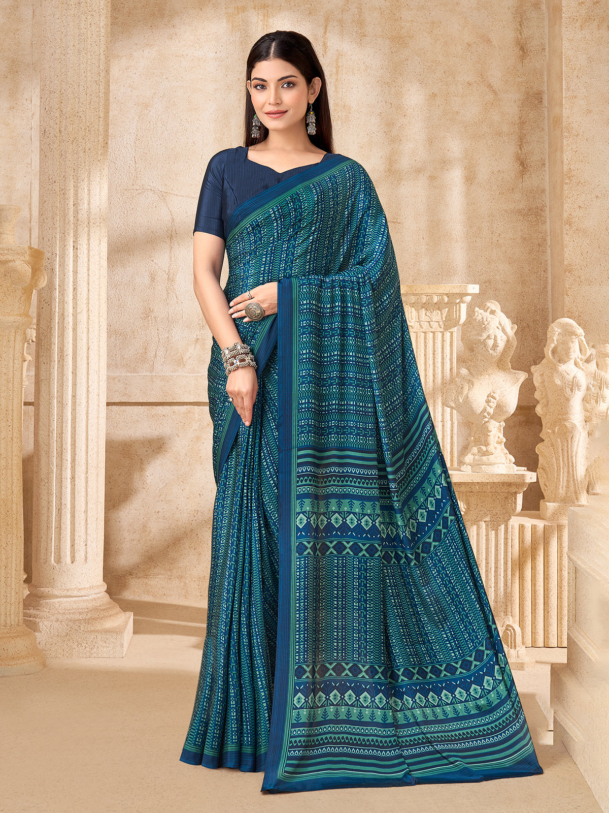 Peacock blue geometric printed crepe silk saree