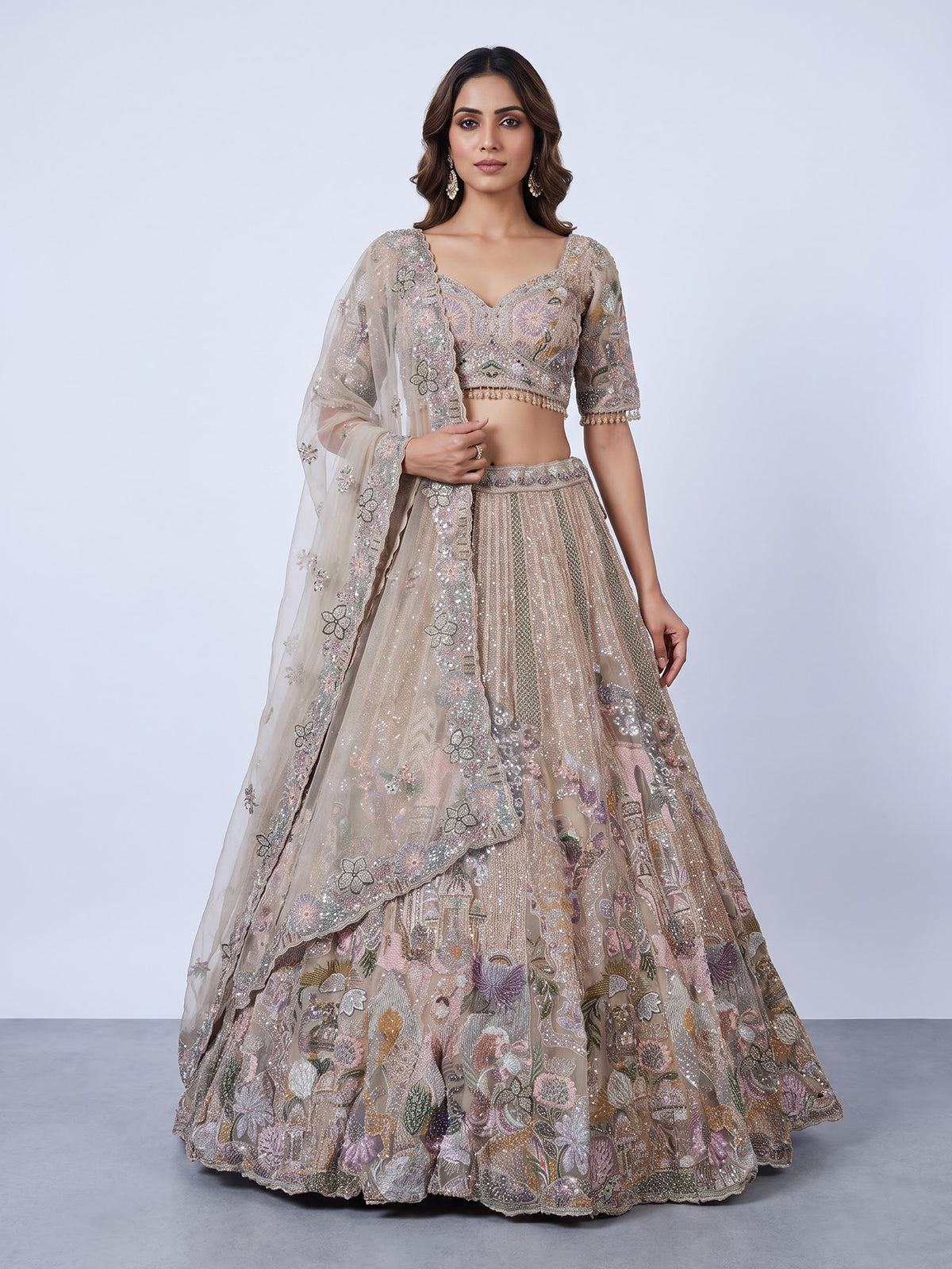 Beige tissue silk lehenga choli with luxurious designer embellishments