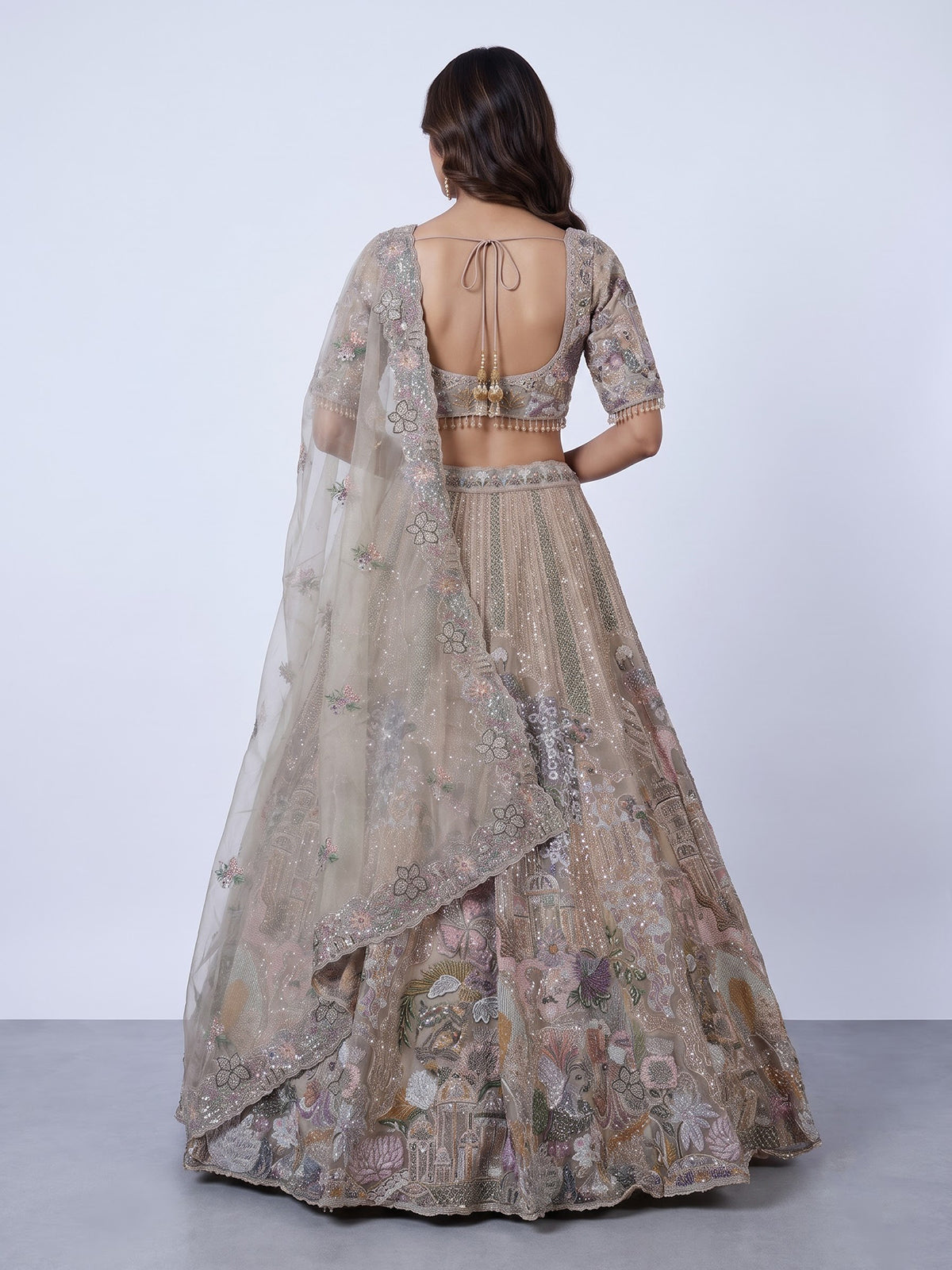 Beige tissue silk lehenga choli with luxurious designer embellishments