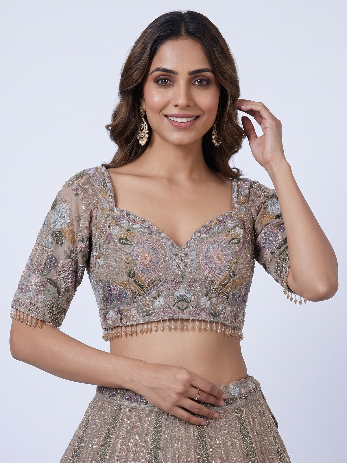 Beige tissue silk lehenga choli with luxurious designer embellishments