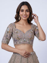 Beige tissue silk lehenga choli with luxurious designer embellishments