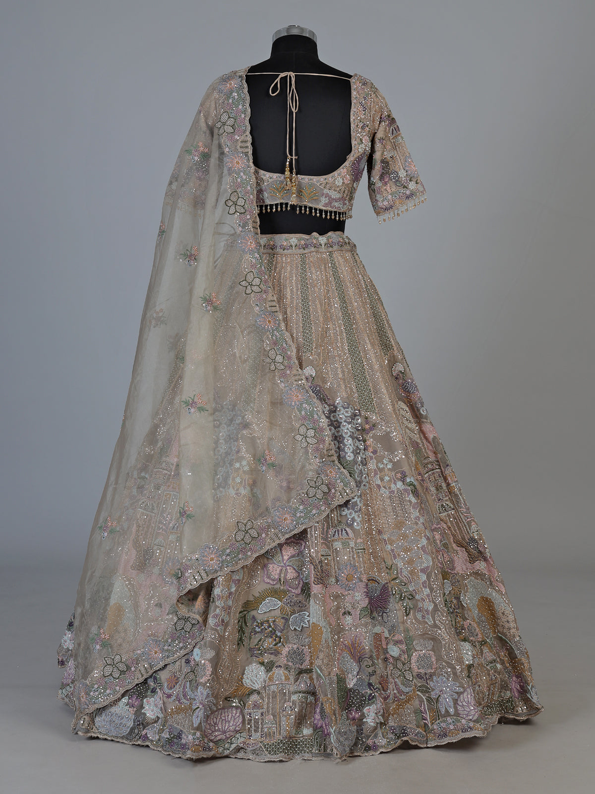 Beige tissue silk lehenga choli with luxurious designer embellishments