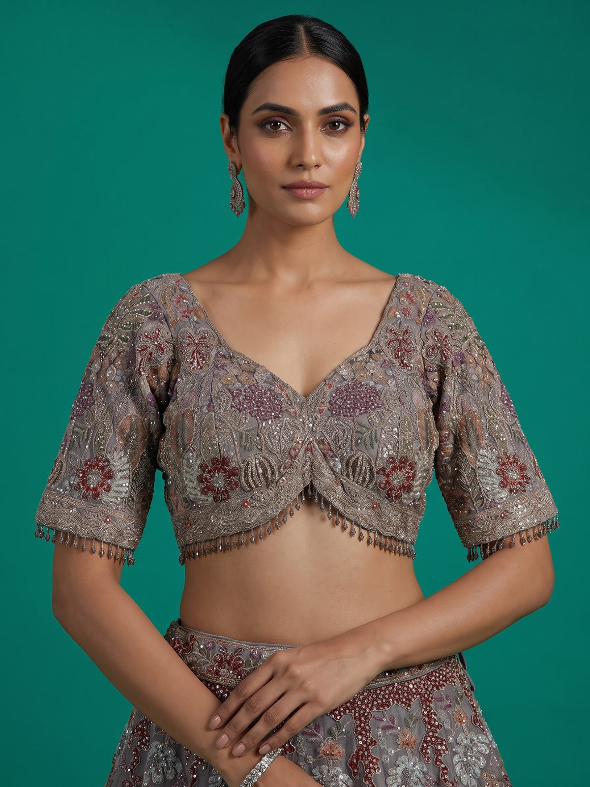 Grey silk lehenga choli with ornate floral and animal motifs