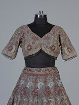 Grey silk lehenga choli with ornate floral and animal motifs