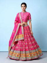 Rani pink silk unstitched lehenga choli with sparkling traditional detailing