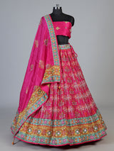 Rani pink silk unstitched lehenga choli with sparkling traditional detailing