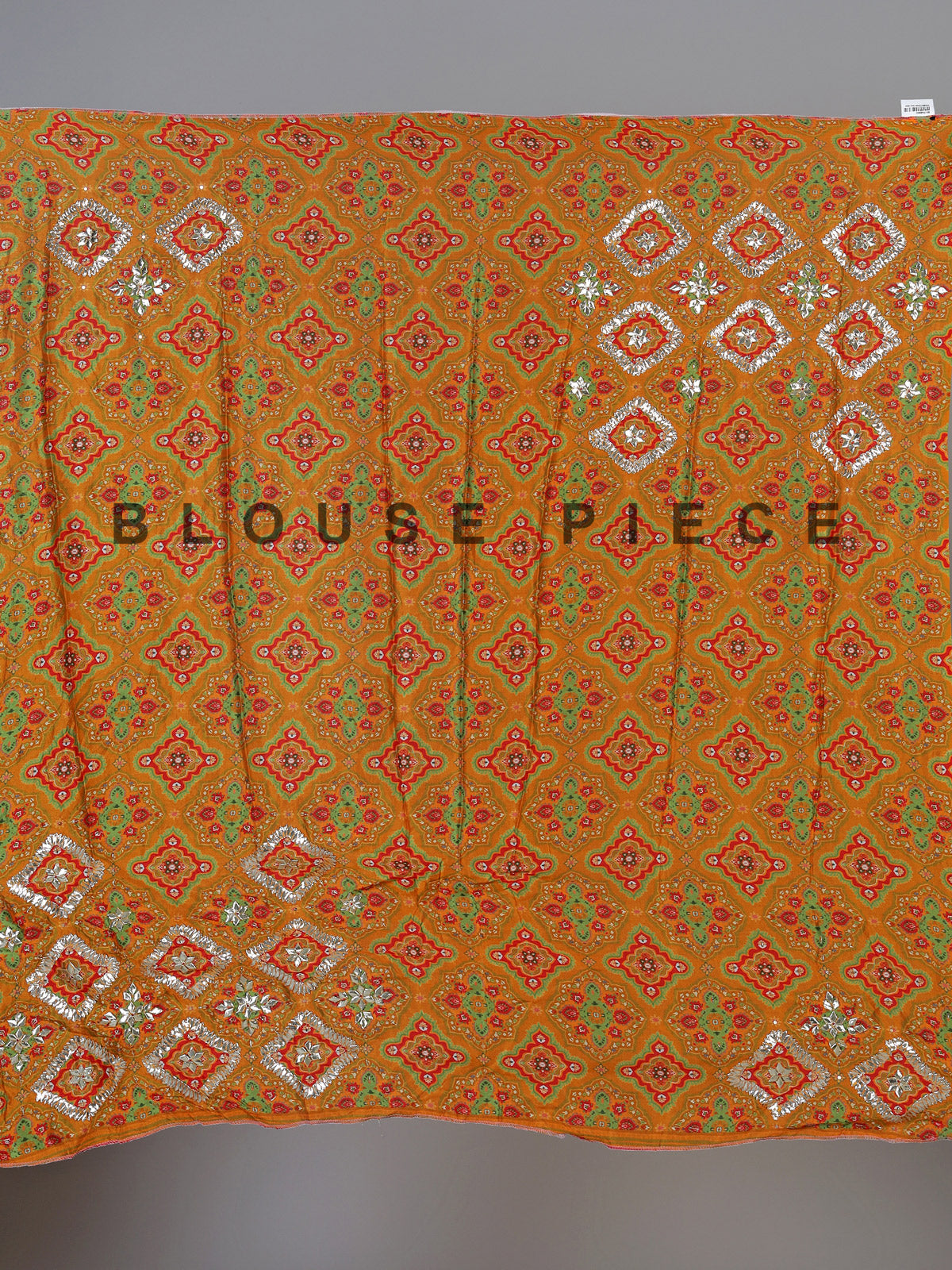 Orange silk unstitched lehenga choli with bandhani elegance
