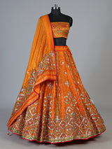 Orange silk unstitched lehenga choli with bandhani elegance