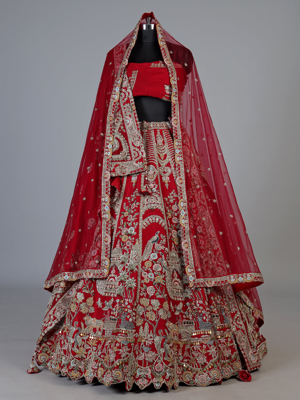 Red raw silk unstitched bridal lehenga choli with artistic detailing