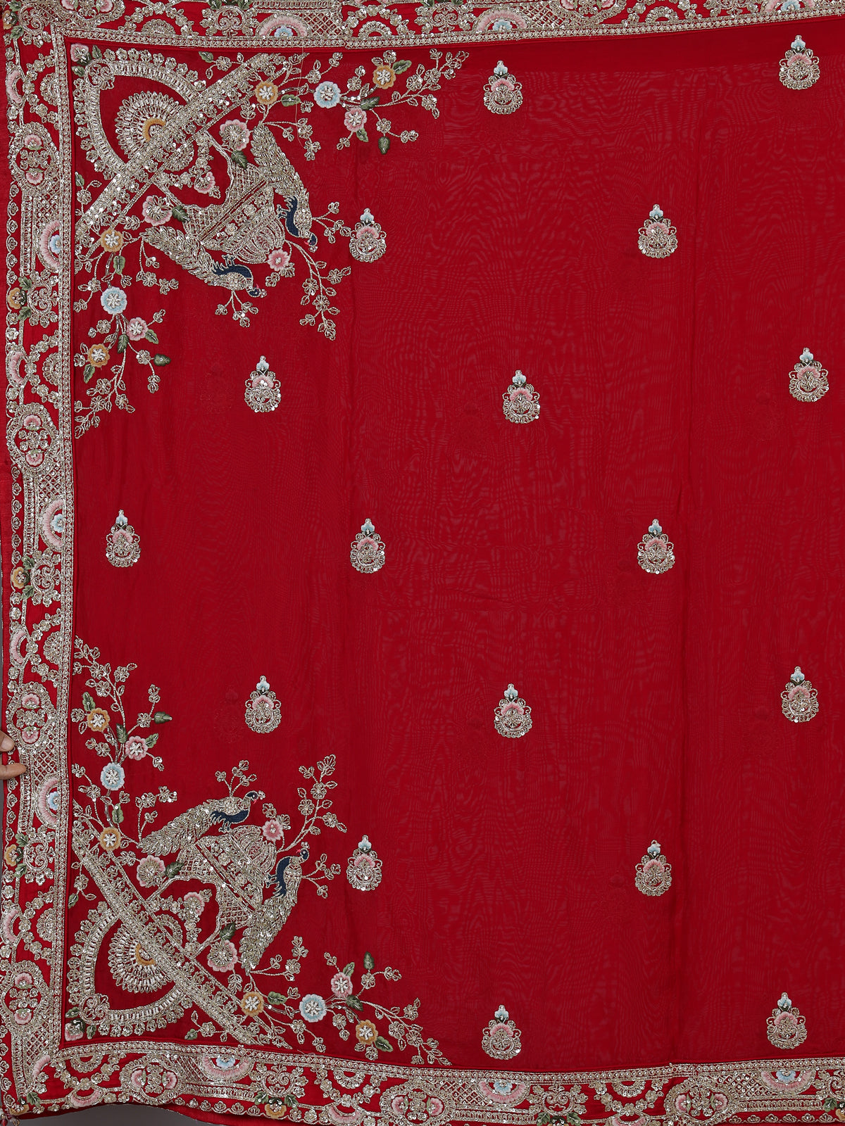 Red raw silk unstitched bridal lehenga choli with artistic detailing