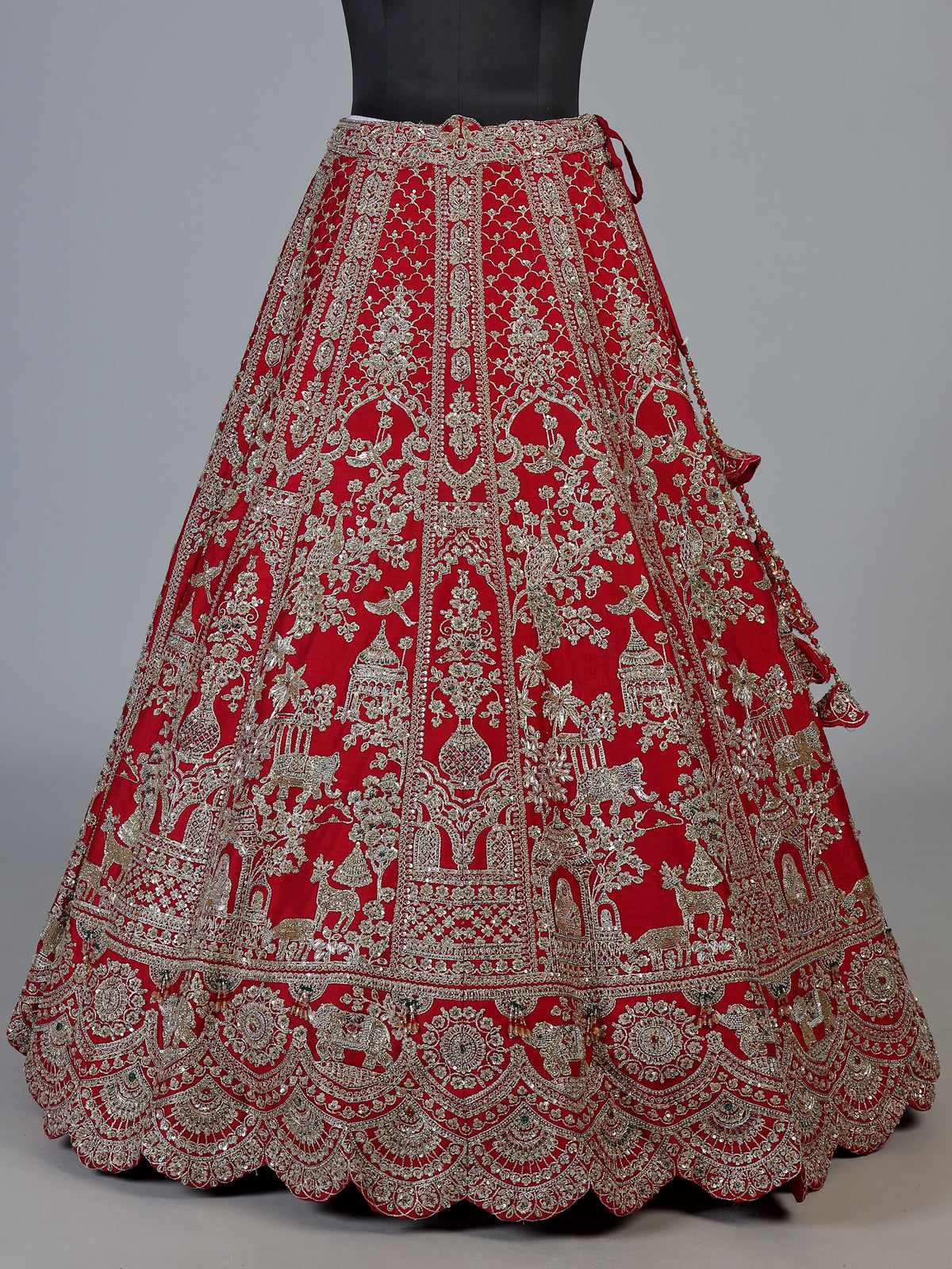 Red raw silk unstitched bridal lehenga choli with ornate craftsmanship