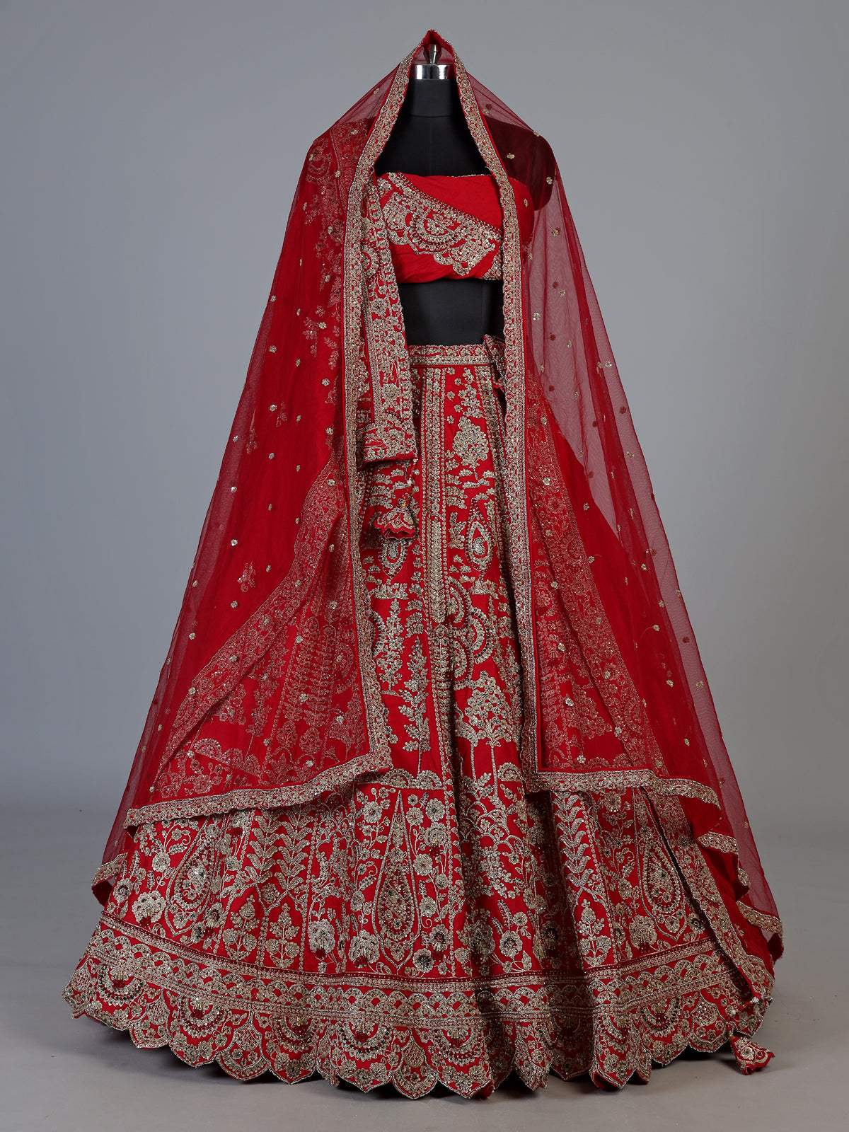 Red raw silk unstitched bridal lehenga choli with lavish detailing