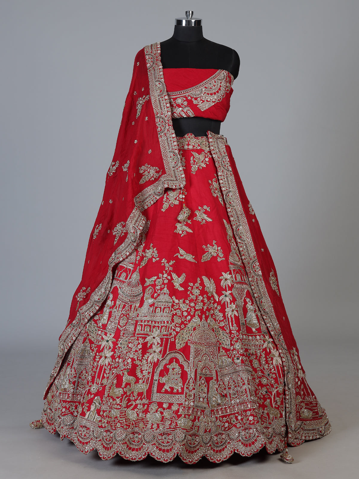 Red raw silk unstitched bridal lehenga choli with artistic motifs
