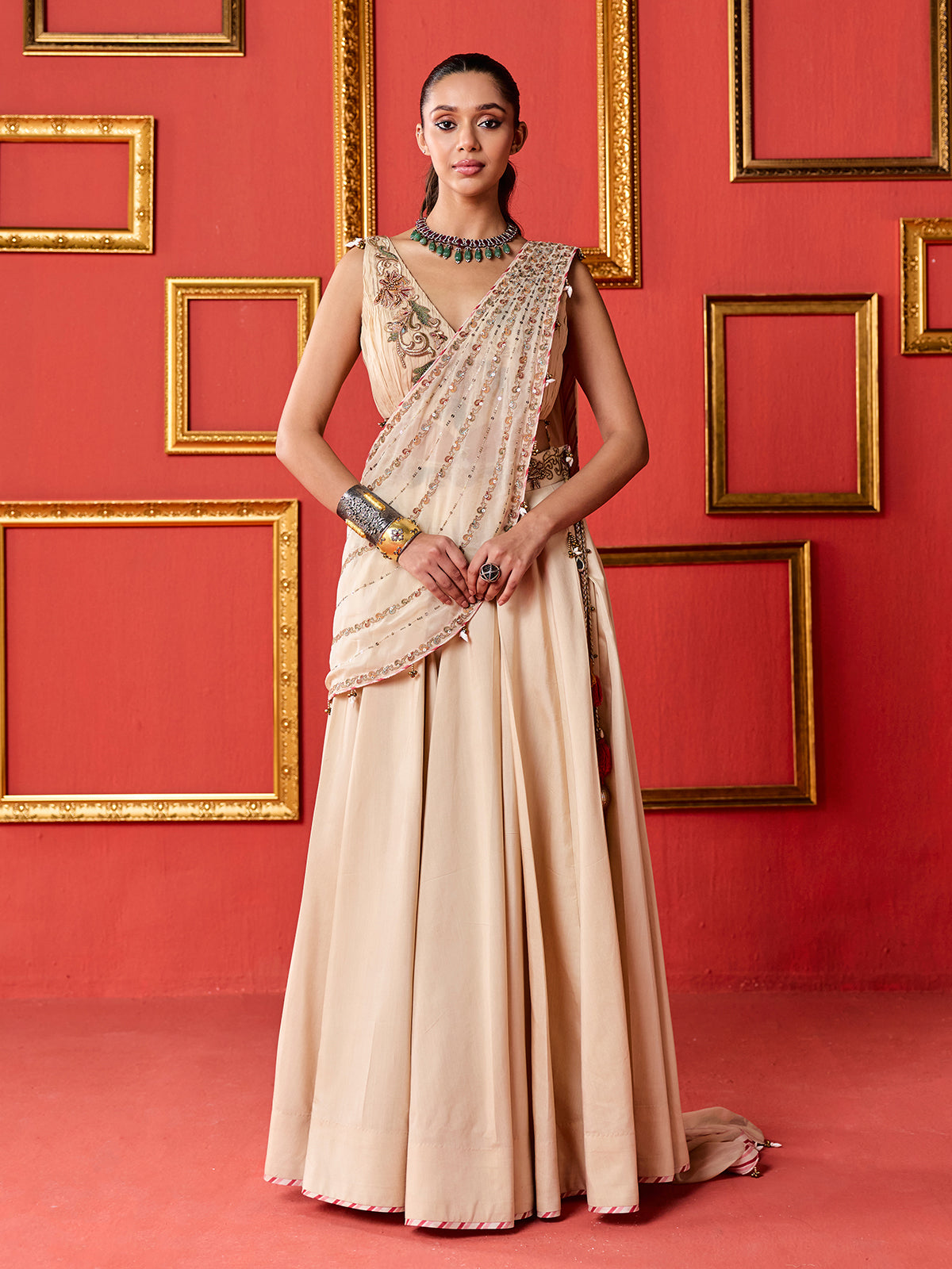 Beige silk designer lehenga choli with tassel accents dupatta
