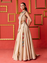 Beige silk designer lehenga choli with tassel accents dupatta