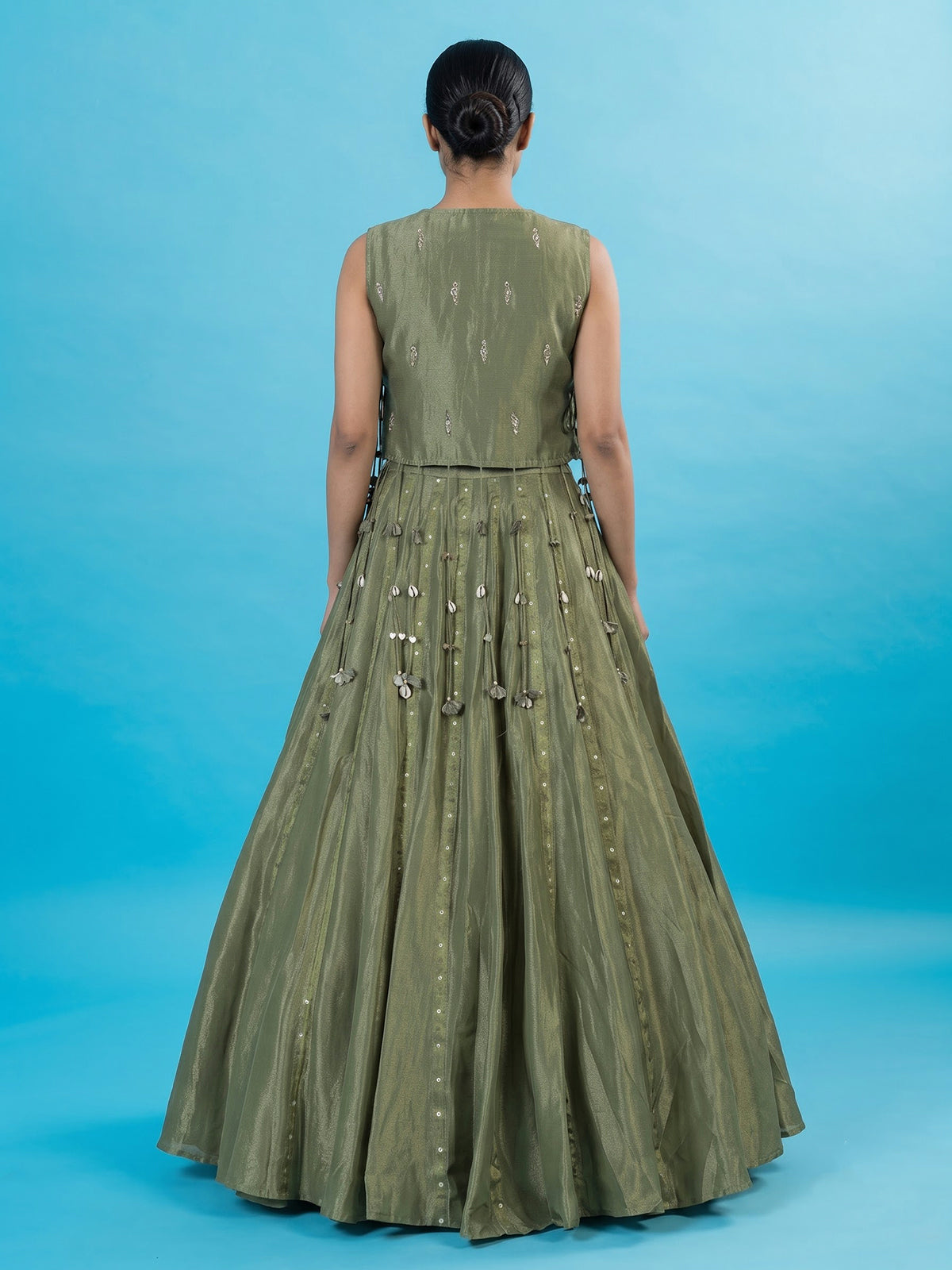 Mehendi green tissue silk lehenga choli with ornate zari craftsmanship