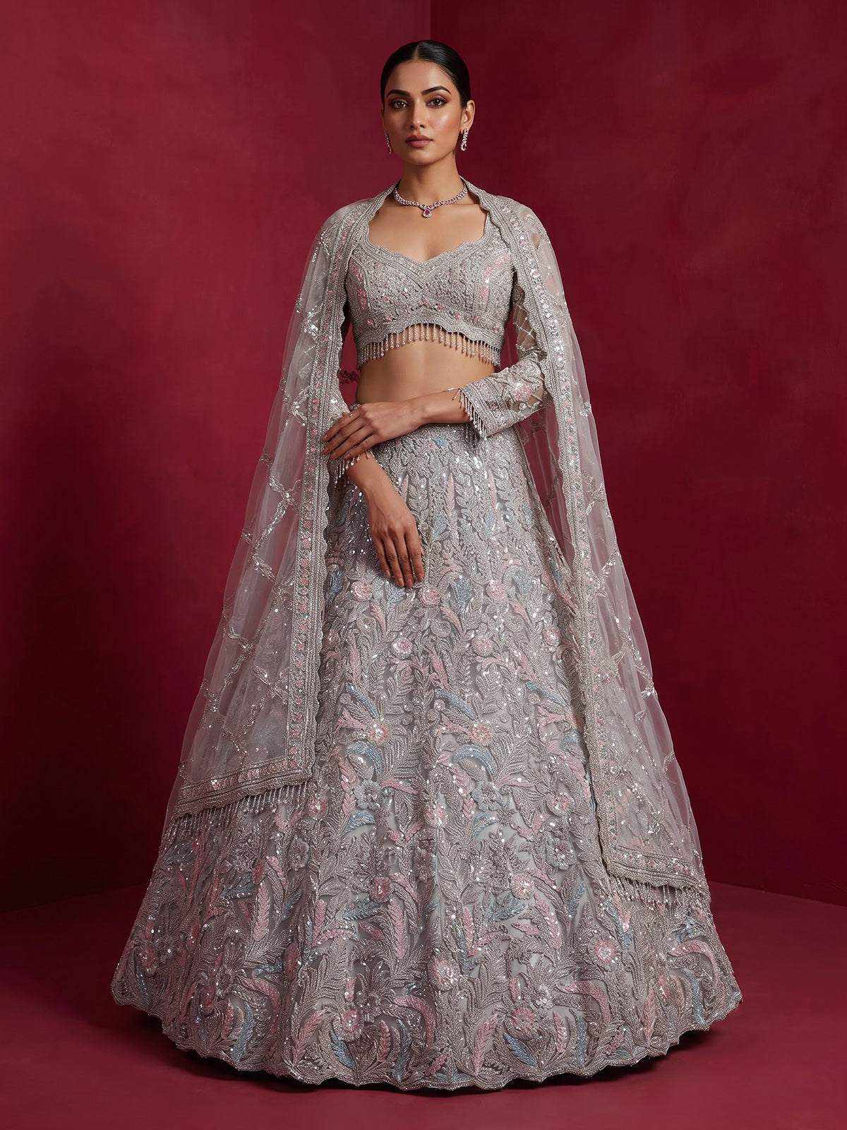 Ice blue net lehenga choli with shimmering diamond embellishments