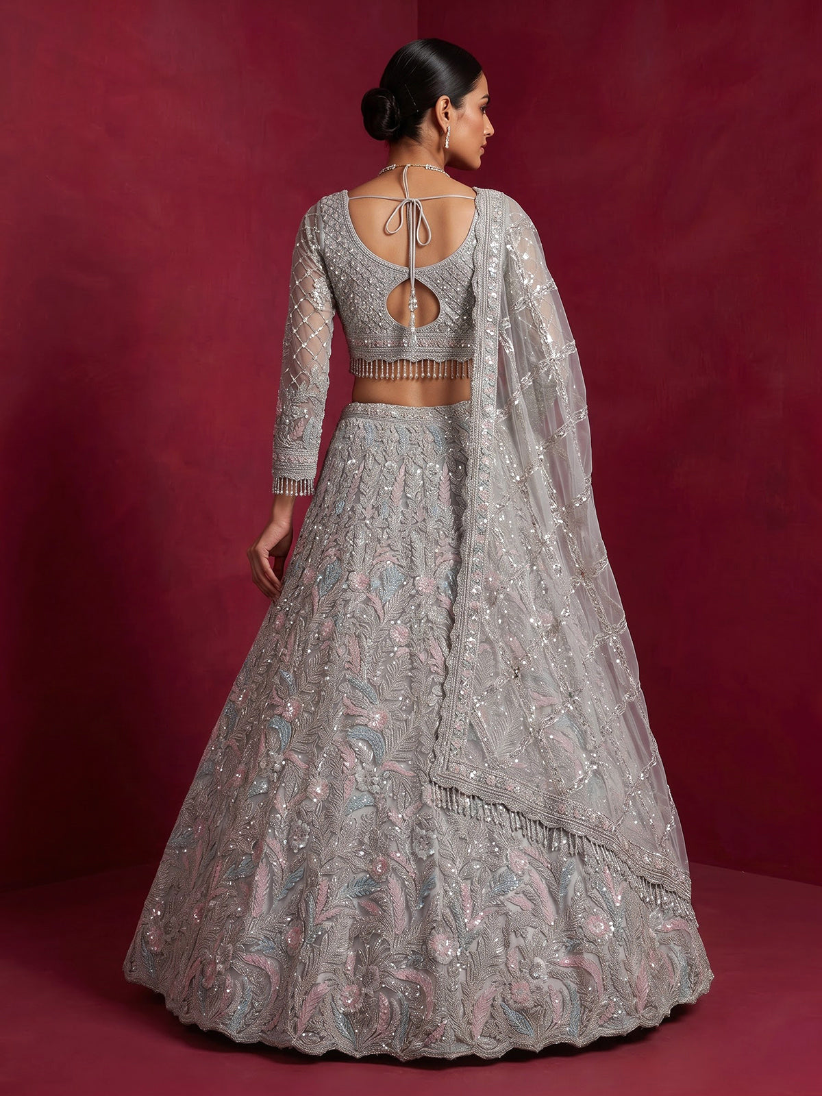 Ice blue net lehenga choli with shimmering diamond embellishments
