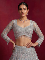 Ice blue net lehenga choli with shimmering diamond embellishments