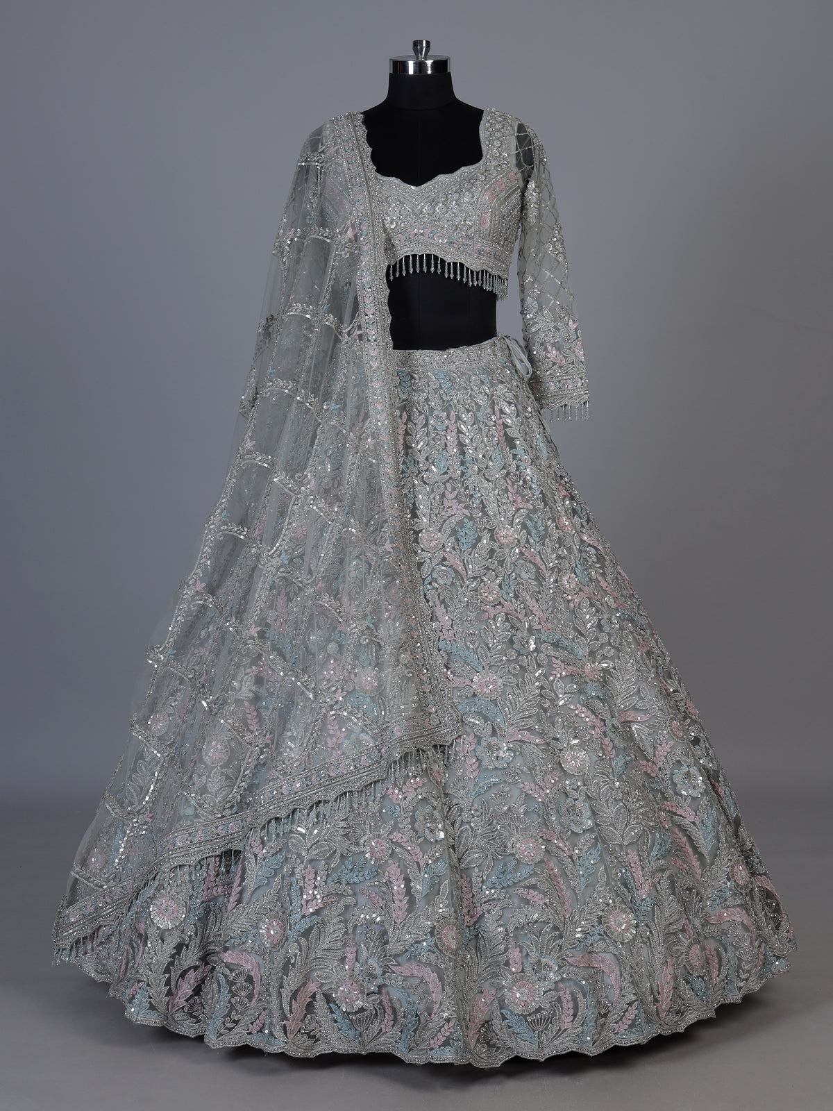 Ice blue net lehenga choli with shimmering diamond embellishments