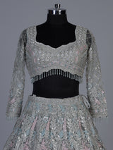 Ice blue net lehenga choli with shimmering diamond embellishments