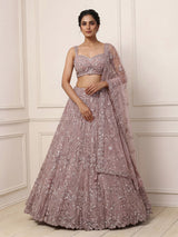 Onion pink net lehenga choli with sparkling heavy embellishments