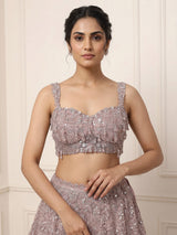 Onion pink net lehenga choli with sparkling heavy embellishments