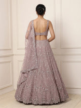 Onion pink net lehenga choli with sparkling heavy embellishments