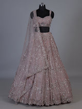 Onion pink net lehenga choli with sparkling heavy embellishments