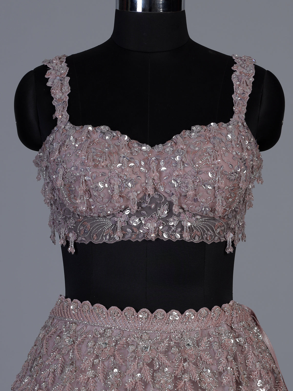 Onion pink net lehenga choli with sparkling heavy embellishments