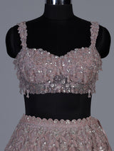 Onion pink net lehenga choli with sparkling heavy embellishments