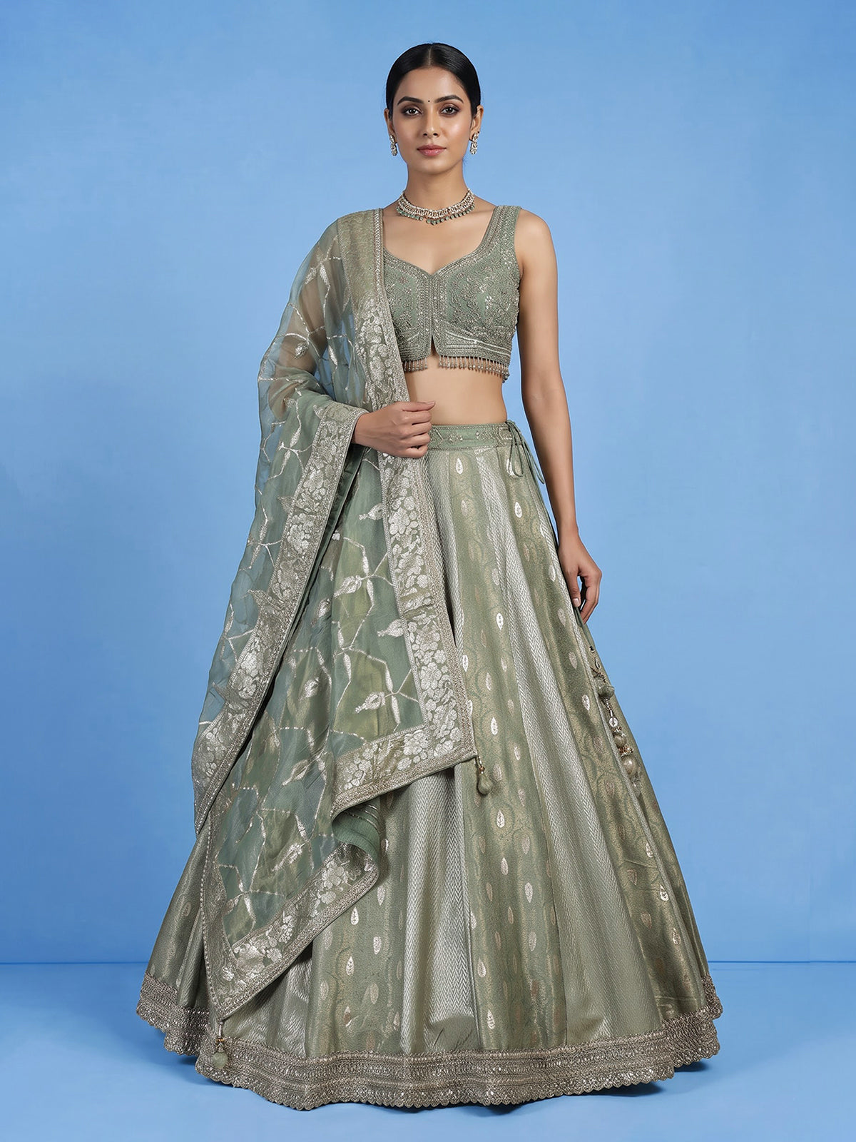 Pista green jacquard brocade lehenga choli with ornate detailing
