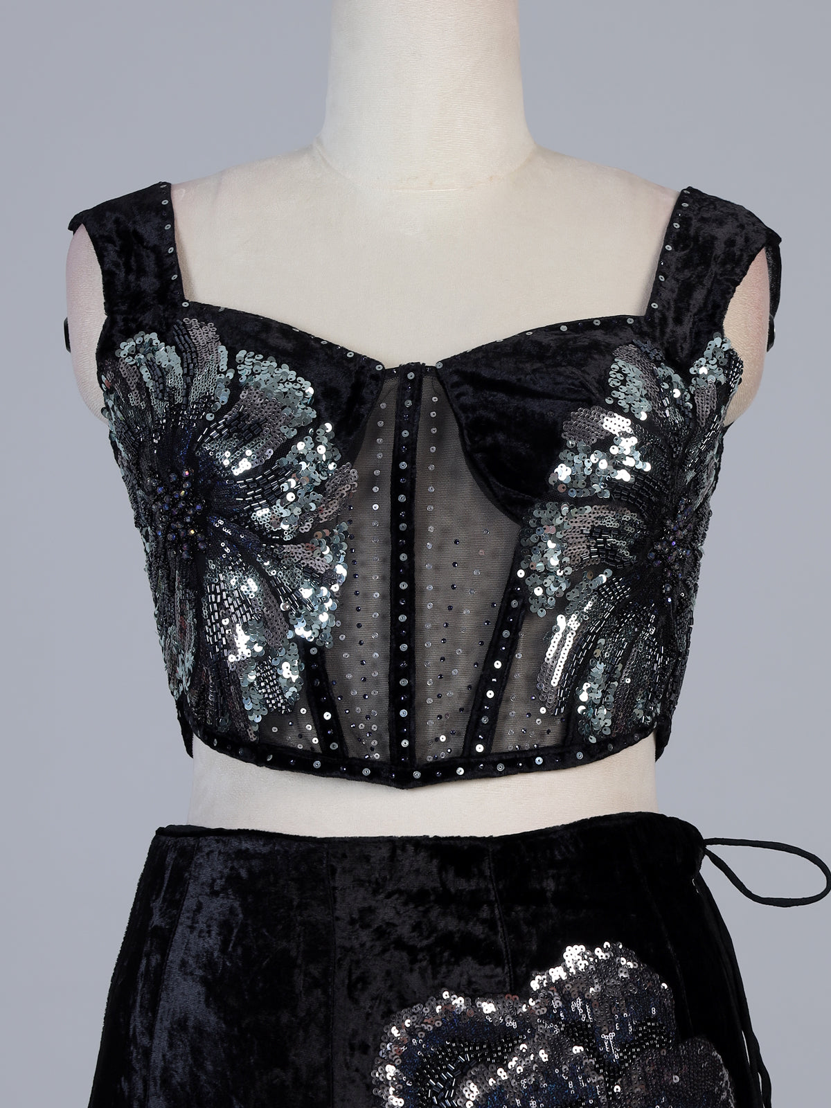 Black velvet lehenga choli with cutdana and pearl embellishments