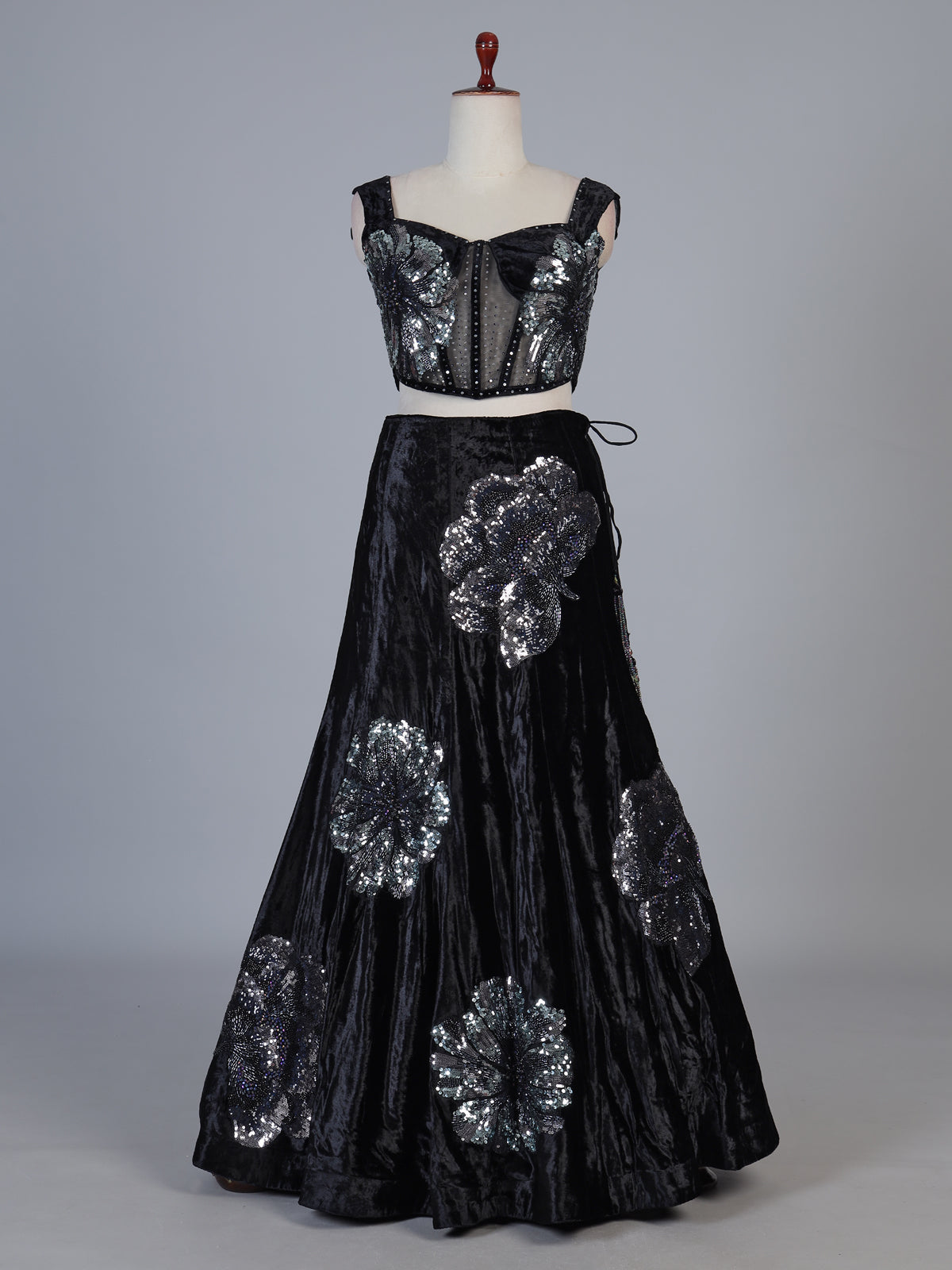 Black velvet lehenga choli with cutdana and pearl embellishments
