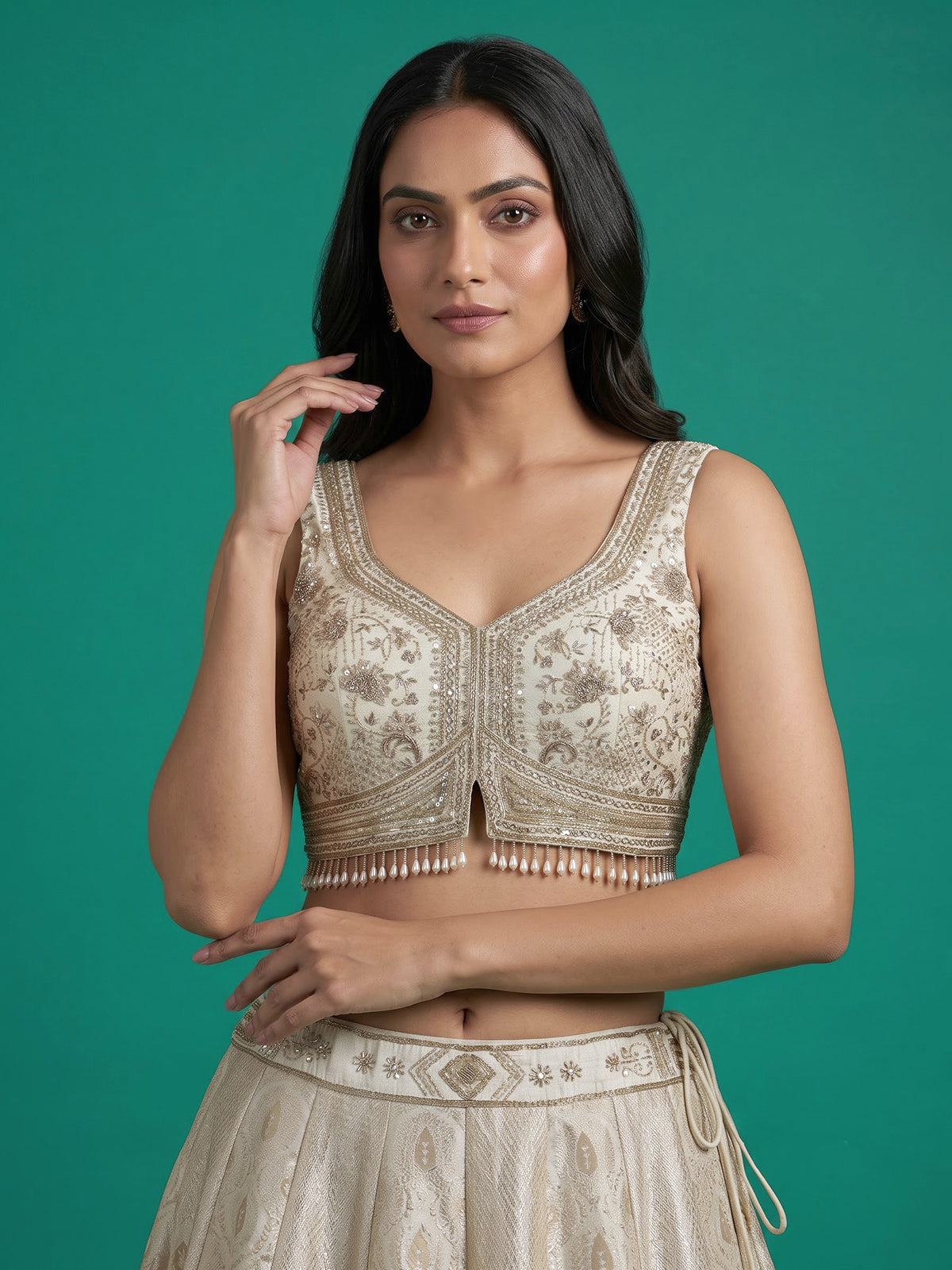Cream jacquard brocade lehenga choli with lavish embellishments