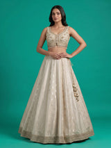 Cream jacquard brocade lehenga choli with lavish embellishments