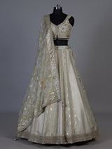 Cream jacquard brocade lehenga choli with lavish embellishments