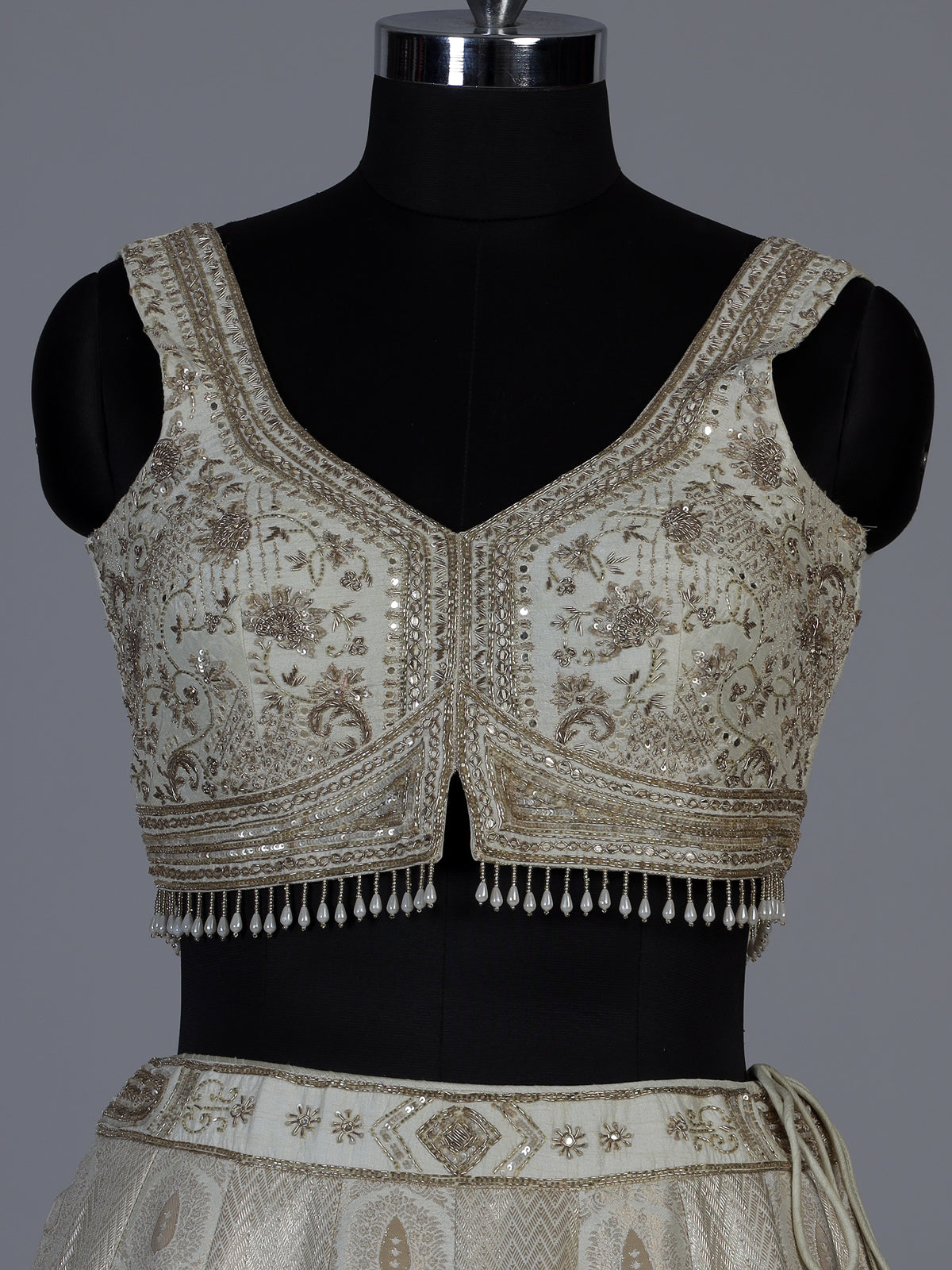 Cream jacquard brocade lehenga choli with lavish embellishments